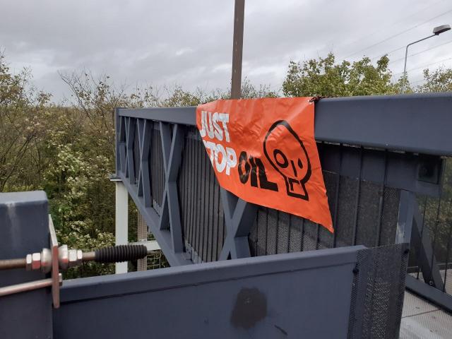 Just Stop Oil banner over M25. - Just Stop Oil