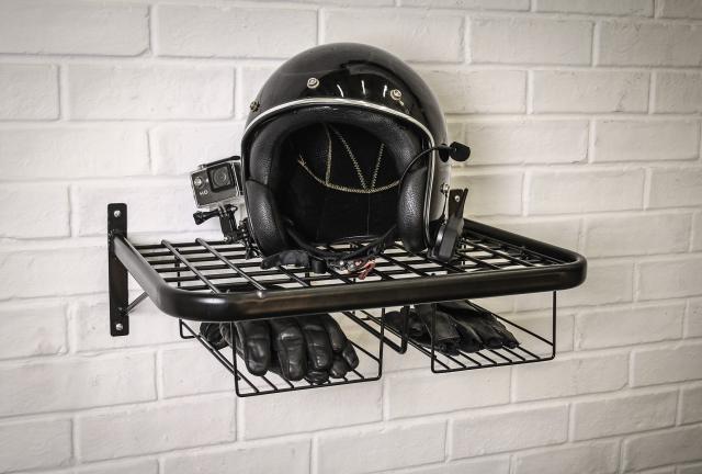 Motorcycle helmet and gear tidy, with a helmet and a gloves