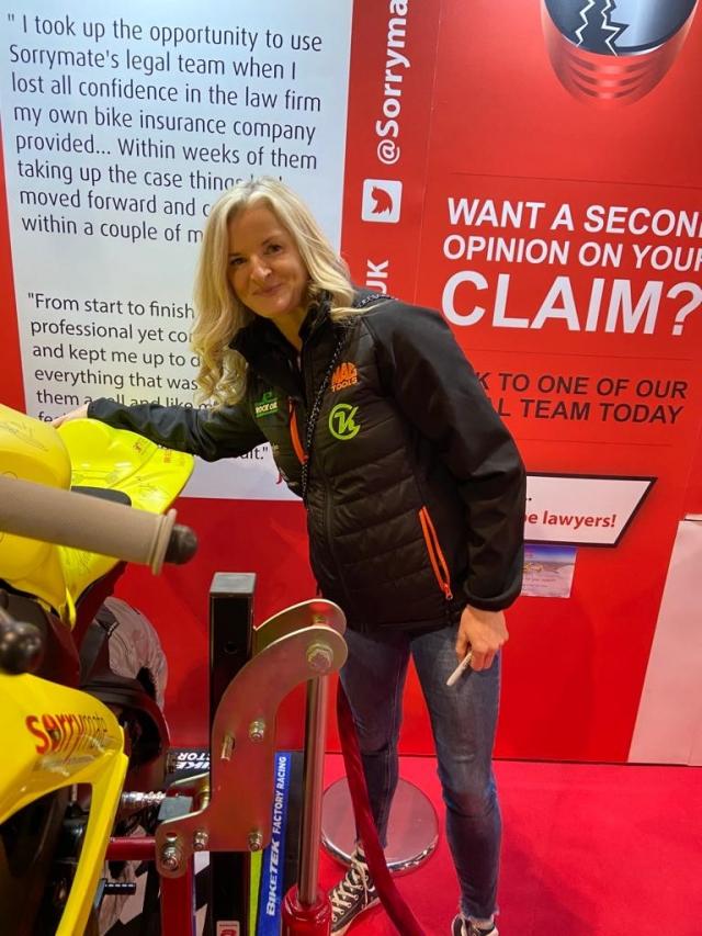 Maria Costello stood in front of the YAA bike