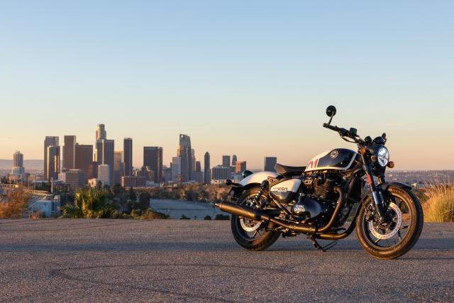 A cruiser motorcycle with the LA skyline in the distance