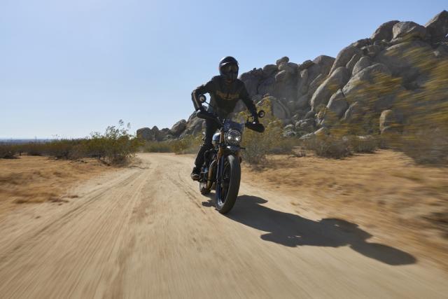 The Scrambler 400 X being ridden on the road