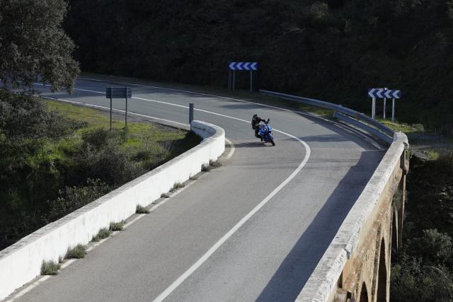 A motorcycle being ridden on a mountain road