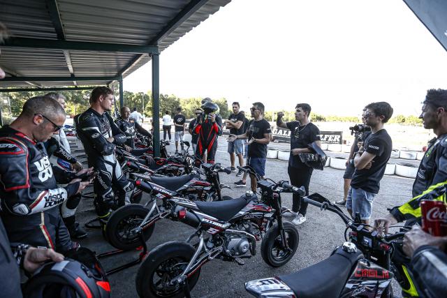 motorbike riders speaking before a race