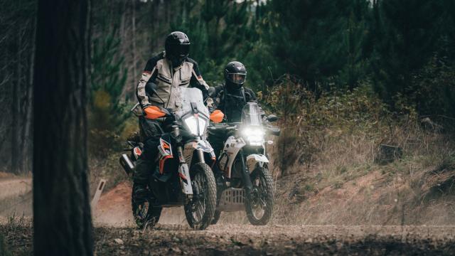 Two adventure bikes. The riders are wearing Forcite MK1S helmets.