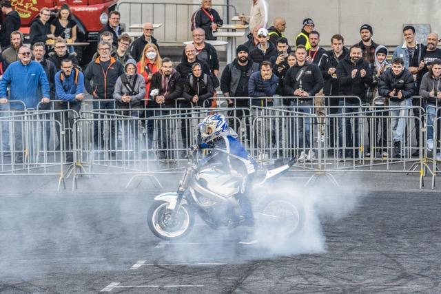 A motorcycle performing a stunt at a show