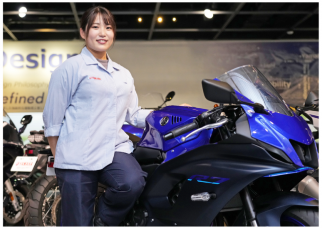 Airi Nakayama standing next to a Yamaha R7. - Yamaha