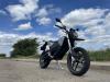Zero Motorcycles FXE 7.2 11KW and blue sky with clouds.