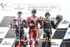 Francesco Bagnaia, Maverick Vinales, Marco Bezzecchi, on 2023 MotoGP Portuguese Grand Prix podium. - Gold and Goose