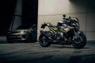 A custom BMW motorcycle and a Range Rover Sport SV