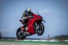 A Ducati pulling a wheelie on track