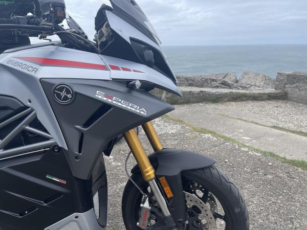 An electric motorcycle looks out to sea