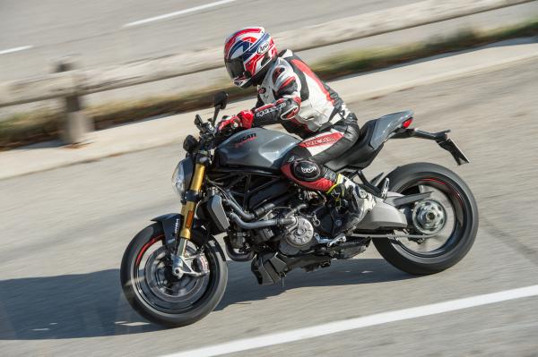 A grey and black 2017 Ducati Monster 1200S being ridden on a road