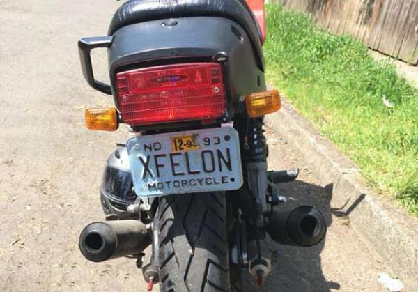 American ex-con nicked on bike with ‘Xfelon’ plate