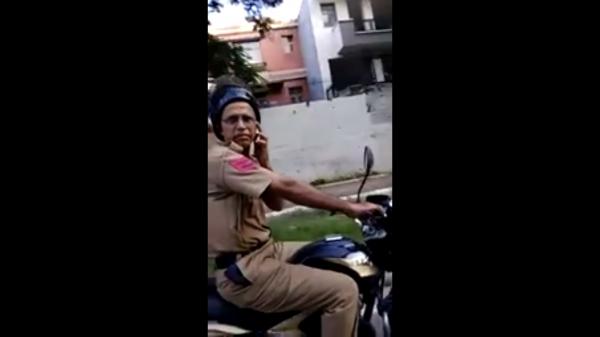A slap in the face for motorcyclist who confronted cop for using phone while riding