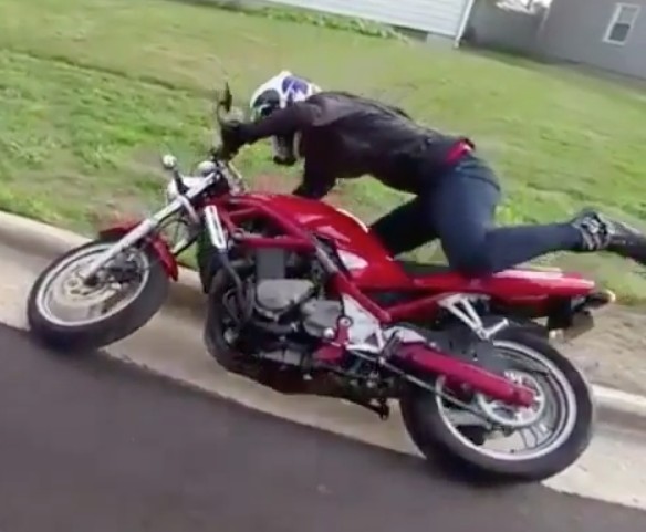 VIDEO: Human attempts to ride motorcycle