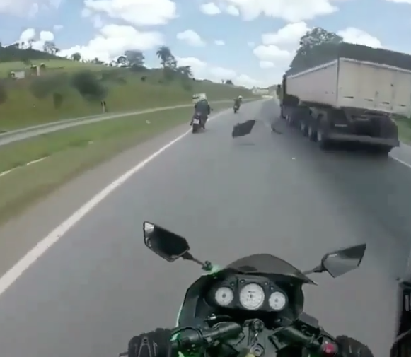Watch: Unlucky rider collides with falling lorry parts