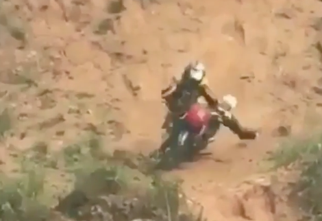 Watch: Rider loses control of his bike before tumbling down a hill