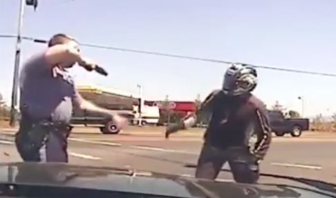 Watch: Police Officer hits biker then pulls gun out on him