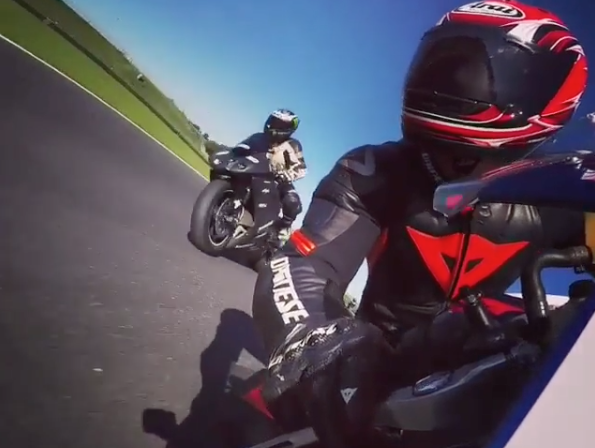 Awesome on-board camera footage of rider getting his knee down on the track
