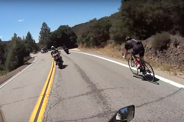 Crazy cyclist overtakes motorcycles on mountain road