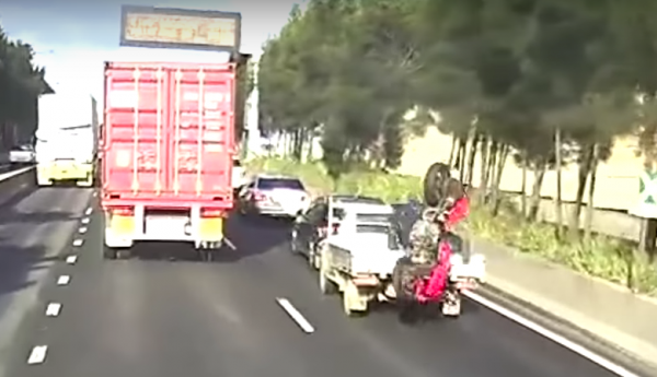 Video: Motorcyclist lands bike in pickup truck