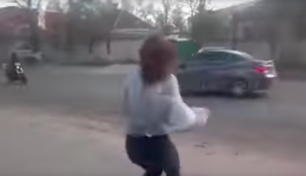 Rider's horrific collision with car after girl twerks on pavement