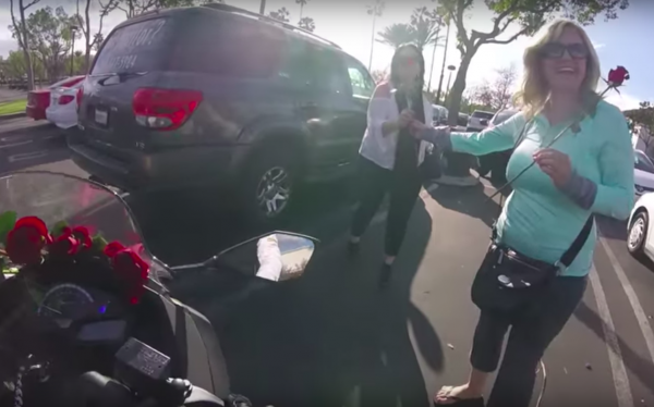 Motovlogger hands out Valentine's Day roses to unsuspecting women