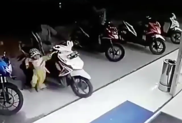 Toddler twists scooter throttle, bike smashes through shop window