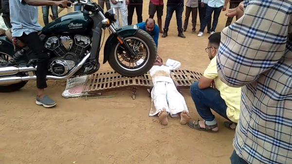 Pandit Dhayagude breaks &#039;being run over by motorcycles&#039; world record. - Pandit Dhayagude/YouTube