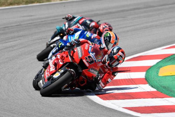 Petrucci survives rubbery brush with Rins for podium