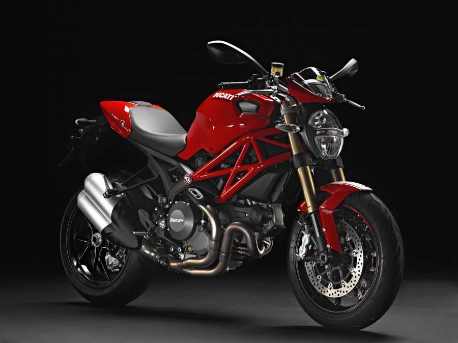 A red and black 2013 Ducati Monster 1100 in a studio