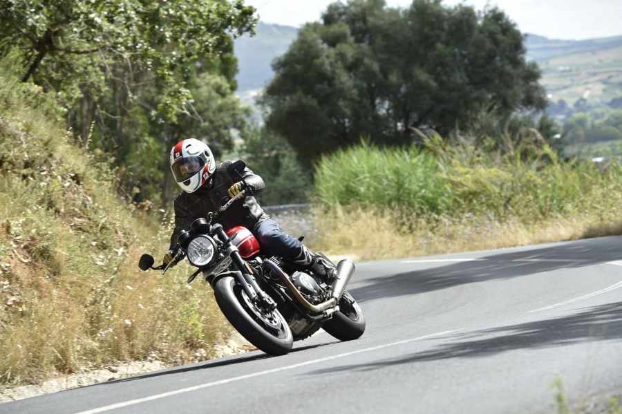 A 2021 Triumph Speed Twin being ridden down a country road