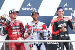 The 2022 MotoGP French Grand Prix podiums, Jack Miller, Enea Bastianini, Aleix Espargaro.  - Gold and goose