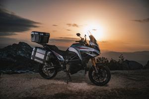 Experia electric sports touring motorcycle at sunset
