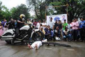 Guinness World Records most motorcycles to run over a person