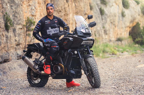 Joan Pedrero sitting on his Pan America rally bike